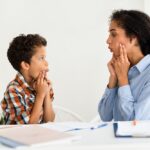 A child participates in speech therapy.