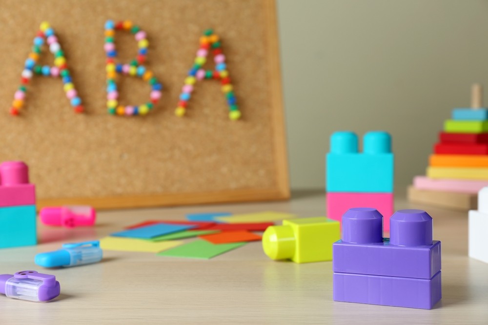 Image of a corkboard with ABA written on it.